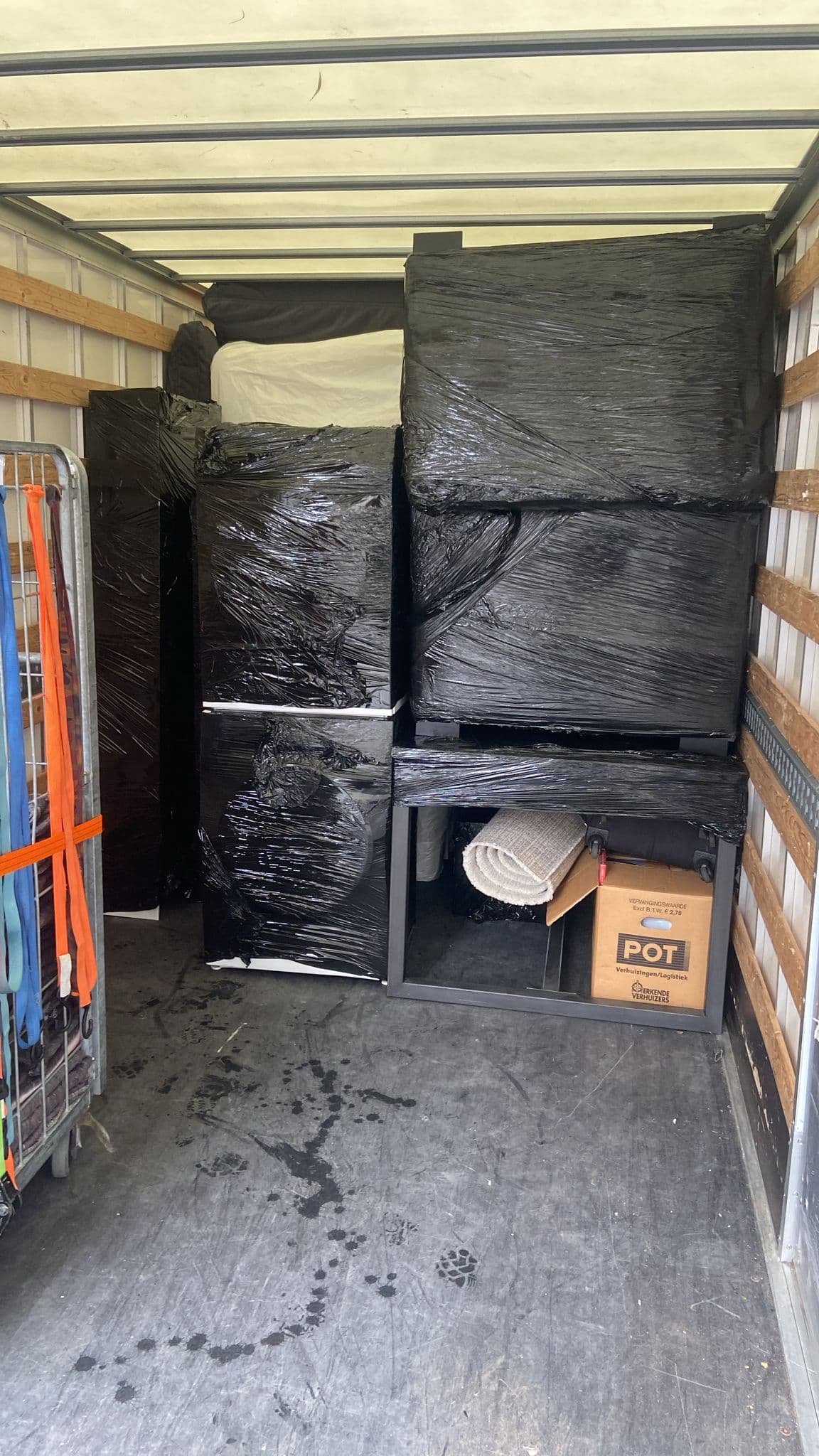 Neatly packed and sealed belongings in the Vrolijk Verhuizen van